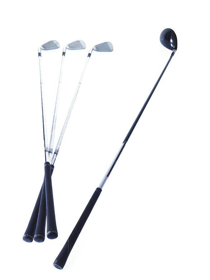Golf clubs on white background Photograph by David Arky