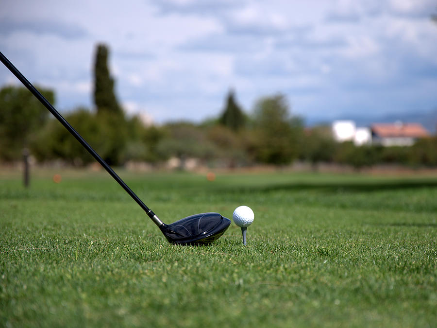 Golfclub And Ball Photograph by Miguel Sotomayor