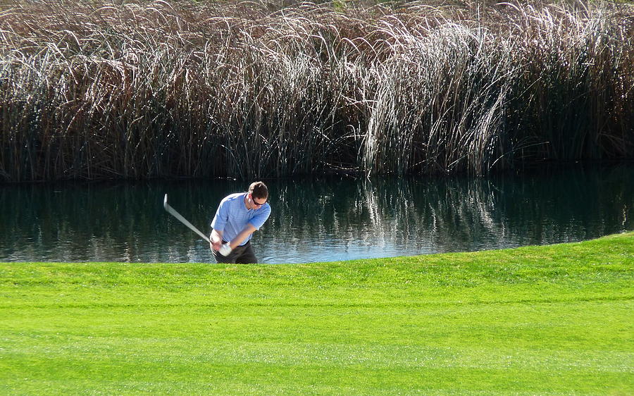 Golfer Swing Water Hazard Photograph by Jeff Lowe