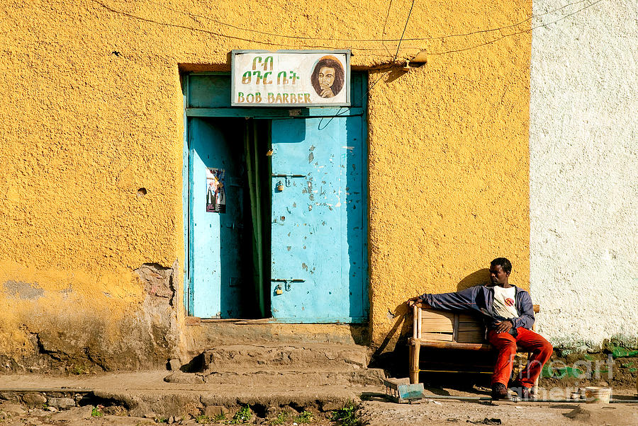 Gonder Ethiopia East Africa Man Relaxing Outside Colourful Barber Shop Photograph by JM Travel Photography