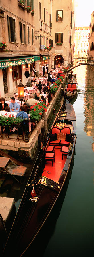 Architecture Photograph - Gondolas Moored Outside Of A Cafe by Panoramic Images