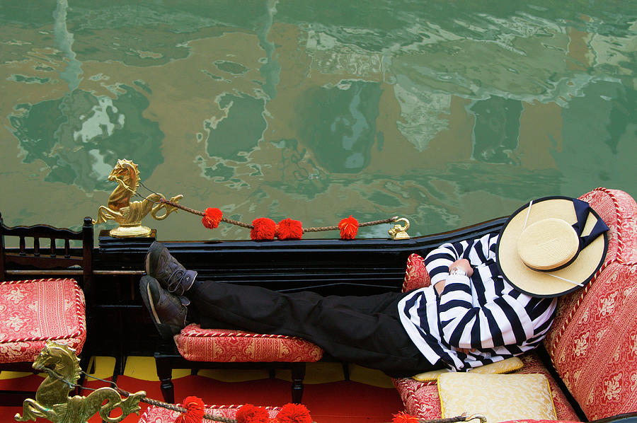 Gondolier Resting In Gondola Photograph by Brent Winebrenner Gondolier Resting In Gondola Photograph by Brent Winebrenner