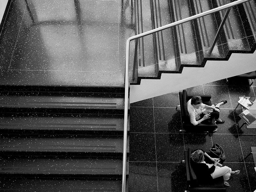 Gossip under the Stairs Photograph by Cornelis Verwaal