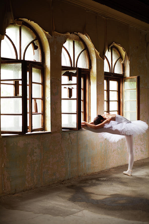 Graceful Ballerina Posing By The Window Photograph by Miljko
