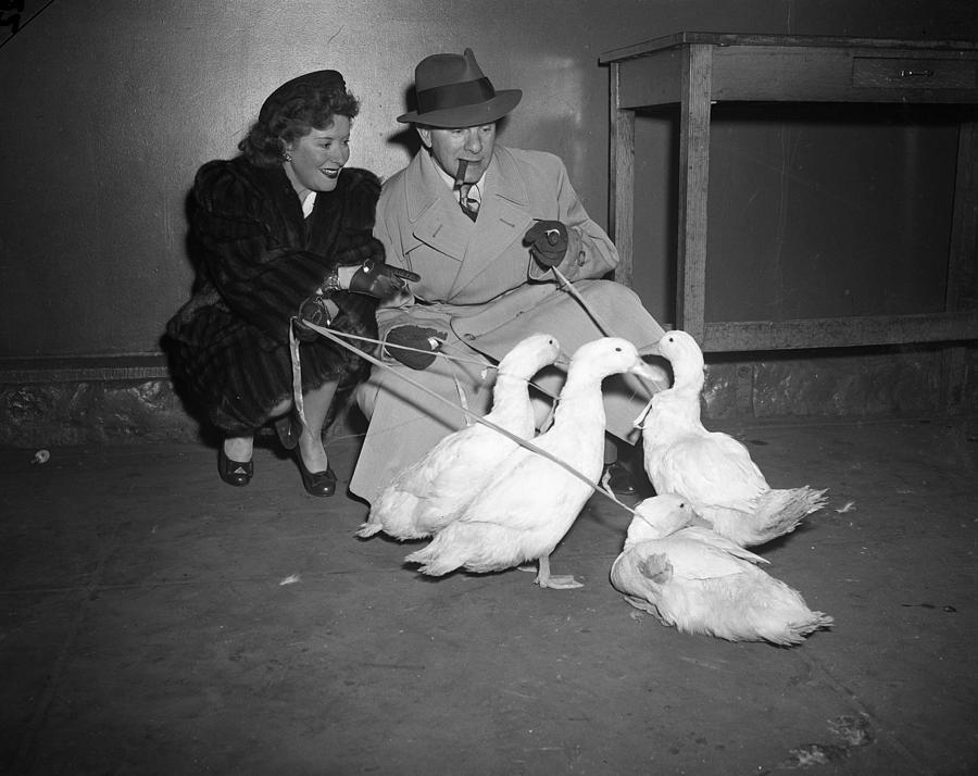 Gracie Allen and George Burns playing with ducks Photograph by Retro Images Archive