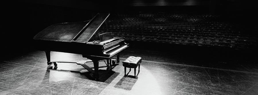 Grand Piano On A Concert Hall Stage Photograph by Panoramic Images