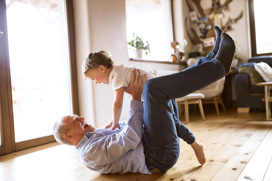 Grandfather and grandson having fun at home Photograph by Westend61
