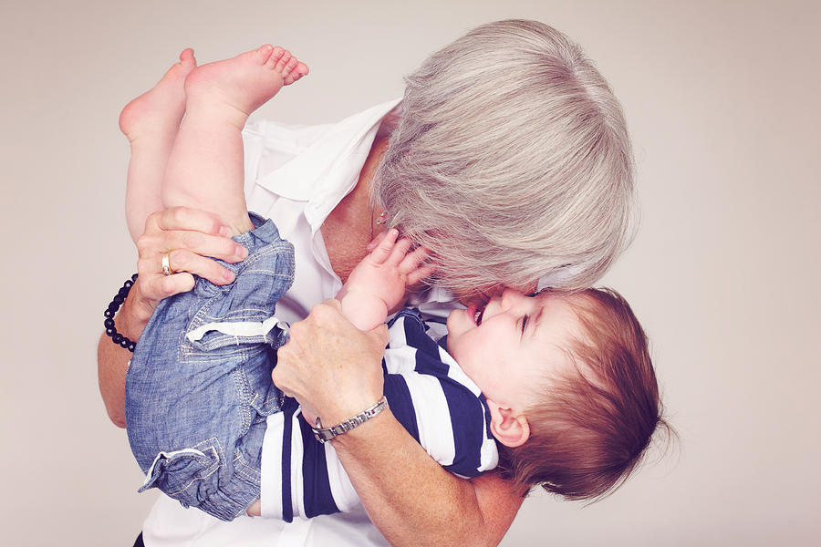 Grandma hugging child Photograph by Fourth + Hazel Photography for awesome kids