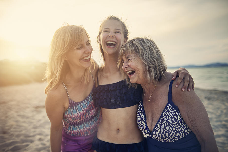 Grandmother, mother and daughter enjoying time together on a beach Photograph by Imgorthand