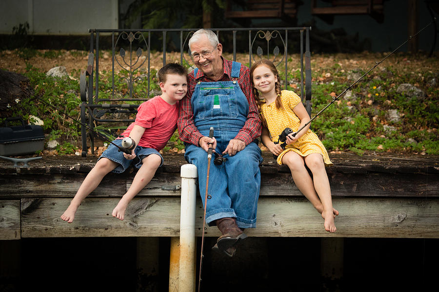 Grandpa Fishing With His Great Grandchildren Photograph by Ideabug