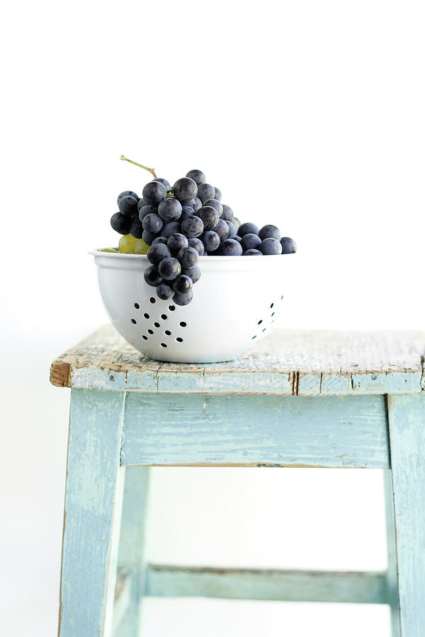 Grapes In Strainer Photograph by Noémi Hauser