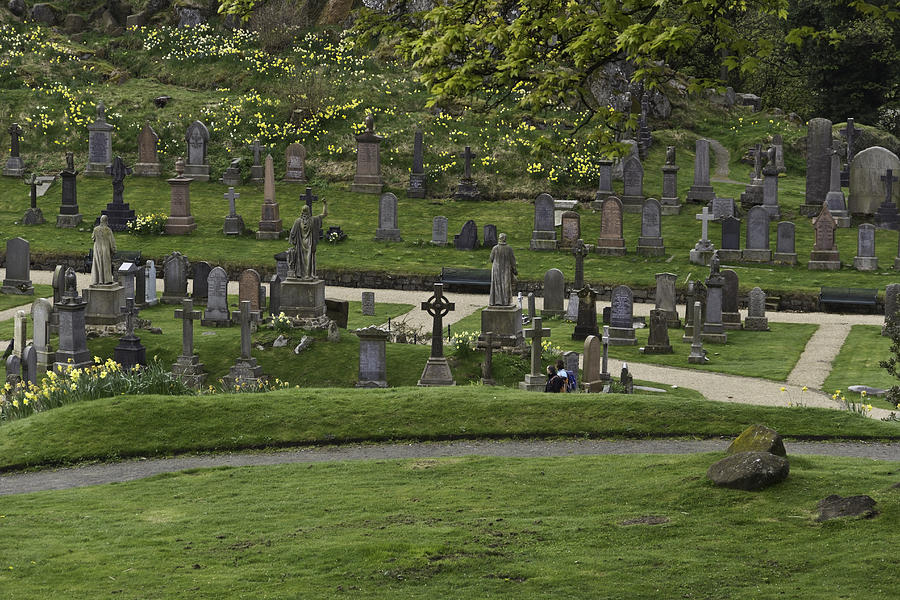 Architecture Photograph - Graves at the cemetery next to Stirling Castle with decorated headstones by Ashish Agarwal