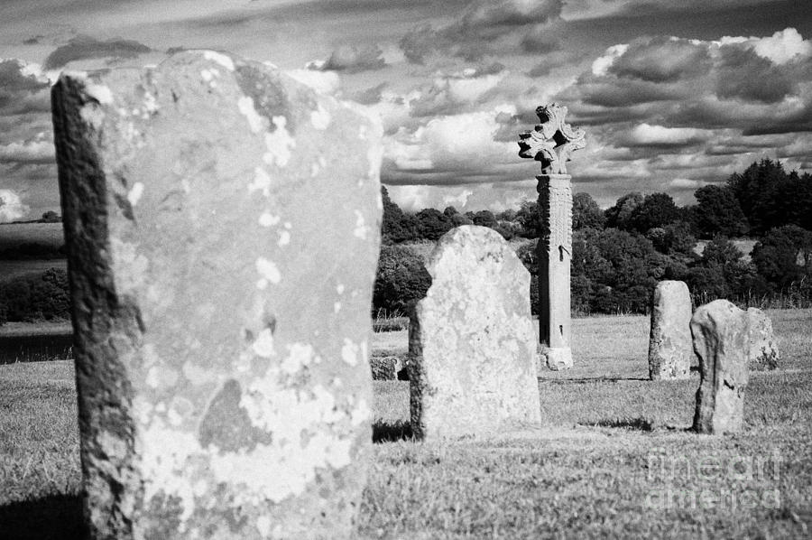 Summer Photograph - Gravestones And Mid 15th Century High Cross In The Graveyard On Devenish Island by Joe Fox