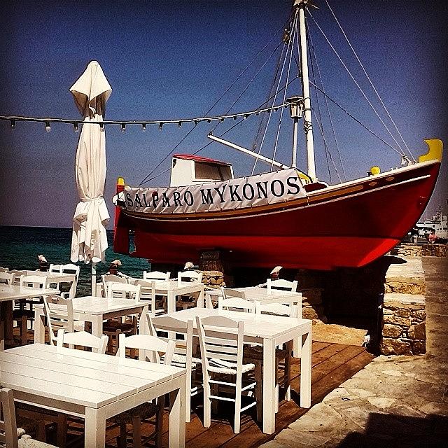 Holiday Photograph - Restaurant by the sea in Mykonos Greece by Maria Grazia Casella