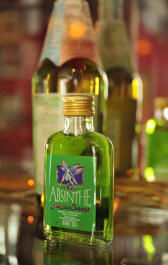 Green Absinthe in small bottle Photograph by Matthias Hauser