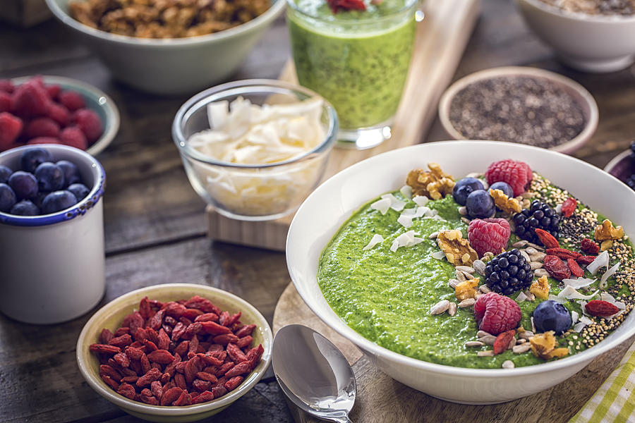 Green Breakfast Smoothie in Bowl with Superfoods on Top Photograph by GMVozd