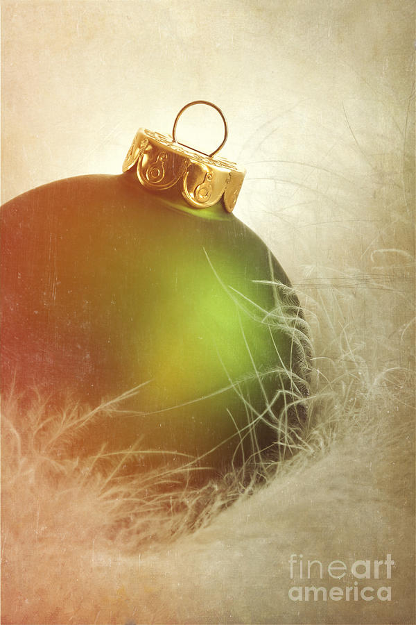 Christmas Photograph - Green christmas ball on soft white feathers by Sandra Cunningham