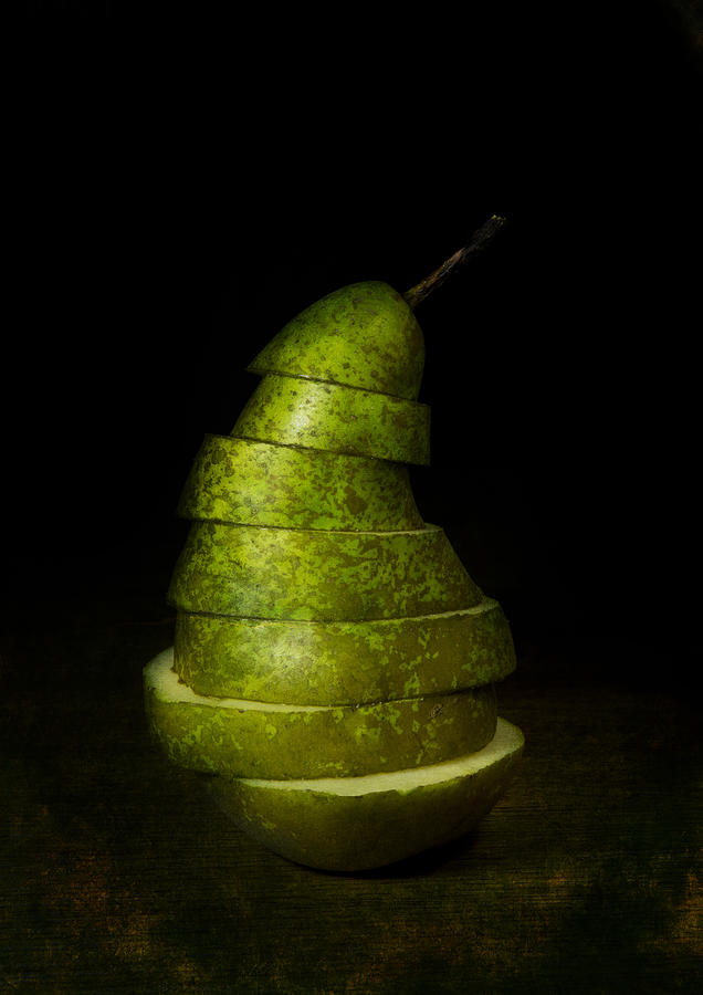 Green sliced pear Photograph by Jaroslaw Blaminsky