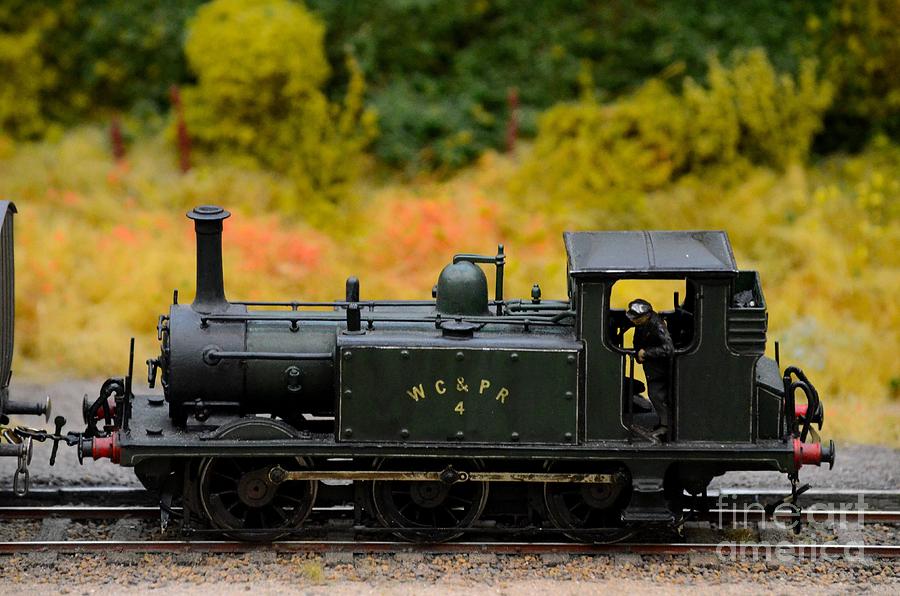 Green weathered steam engine with driver model train Photograph by Imran Ahmed