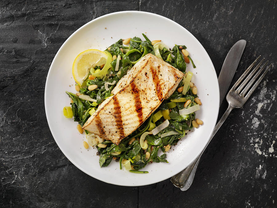 Grilled Halibut with Spinach, leeks and Pine Nuts Photograph by LauriPatterson
