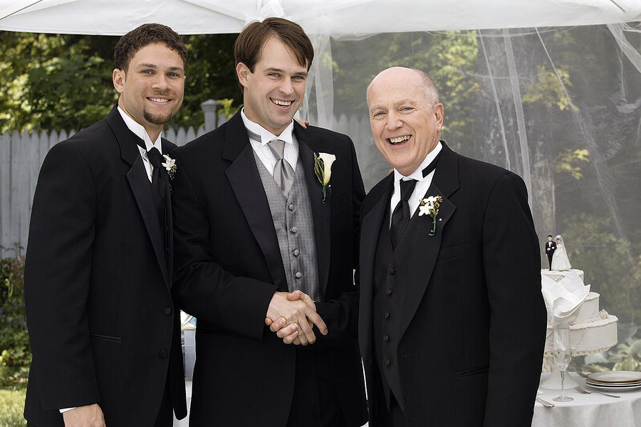 Groom , father , and best man Photograph by Comstock Images