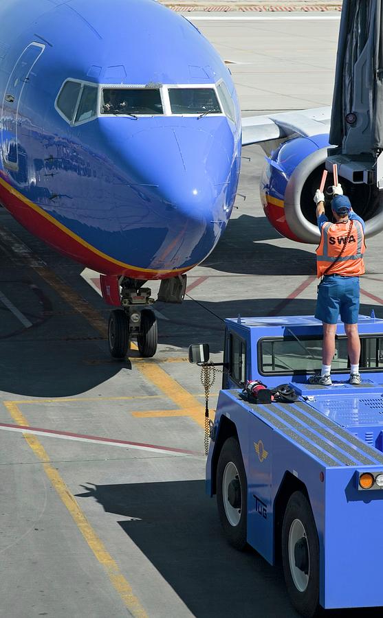 Ground Crew Directing Jet Airliner Photograph by Jim West - Fine Art ...