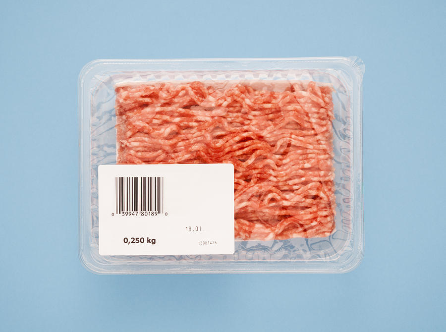 Ground pork in plastic packaging Photograph by Jorg Greuel