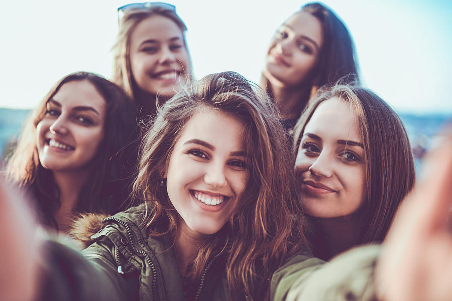 Group of Crazy Girls Taking Selfie and Making Faces Outdoors Photograph by AleksandarGeorgiev