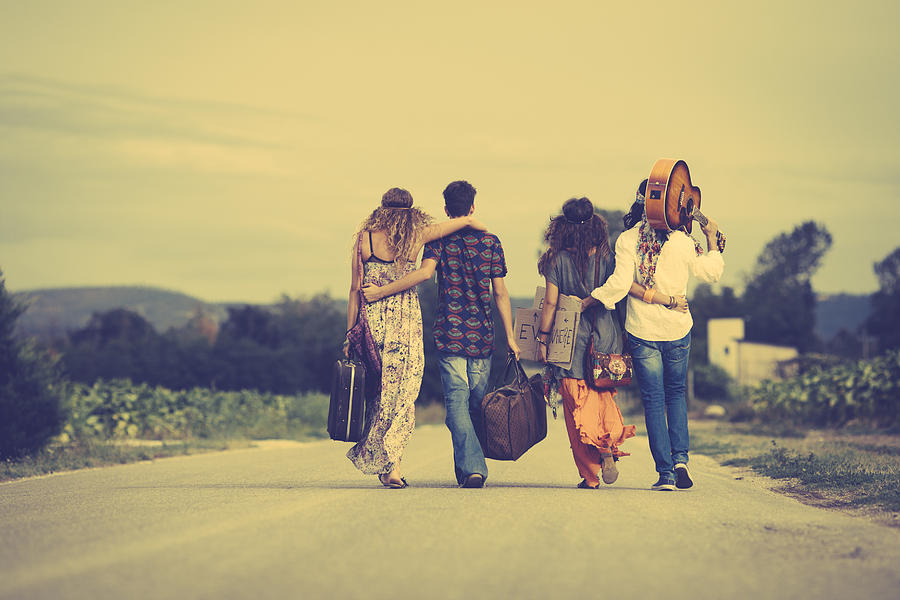 Group of hippie friends walk away Photograph by Kaisersosa67