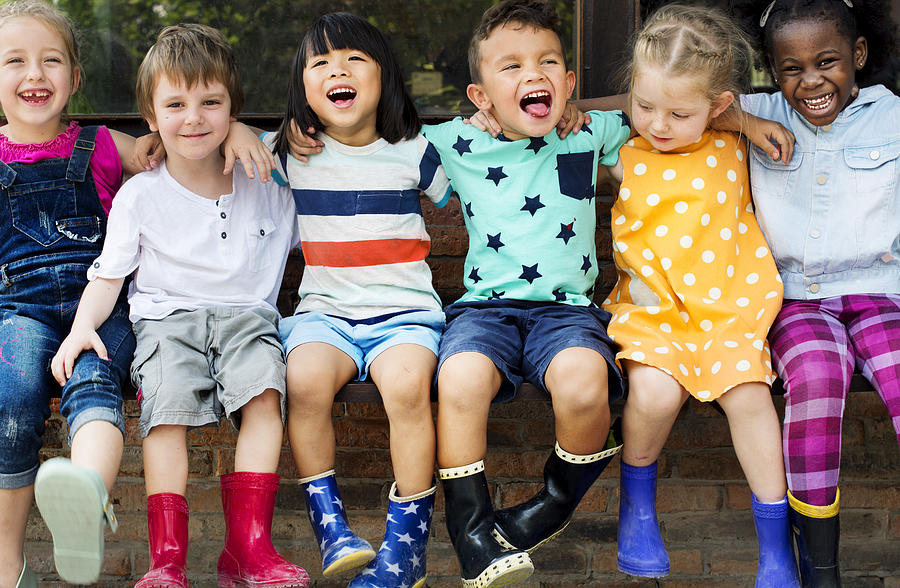 Group of kindergarten kids friends arm around sitting and smiling fun Photograph by Rawpixel