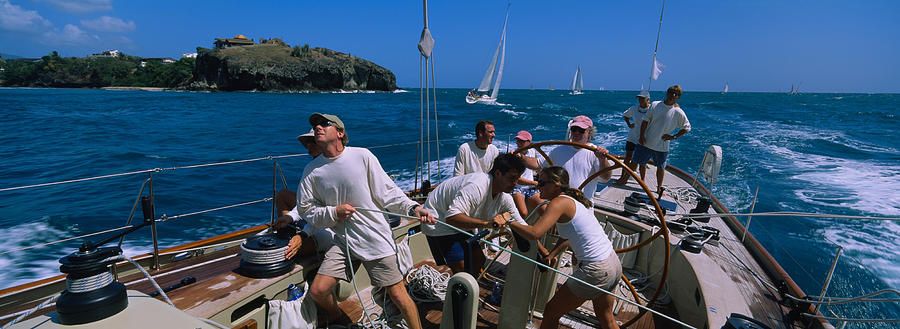 Transportation Photograph - Group Of People Racing In A Sailboat by Panoramic Images