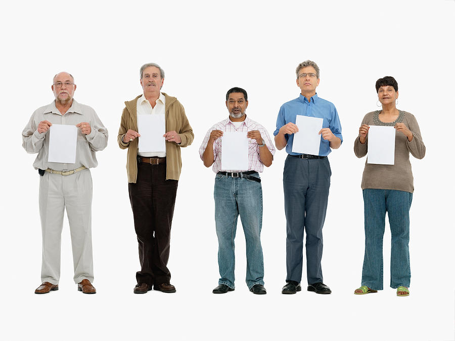 Group of people standing in a row holding papers Photograph by Momentimages