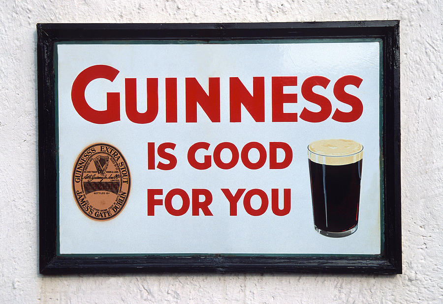 Guinness sign Photograph by Dennis Cox