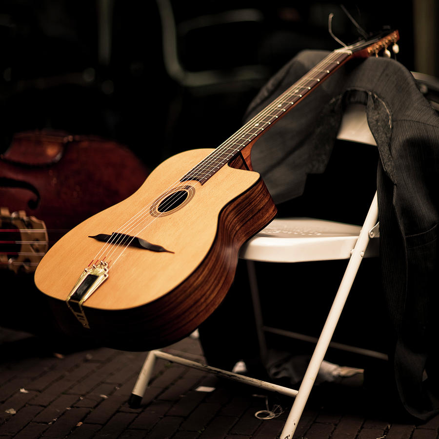 Guitar On Chair, Belonging To Street Photograph by Merten Snijders
