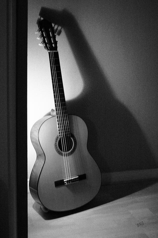 black acoustic guitar photography