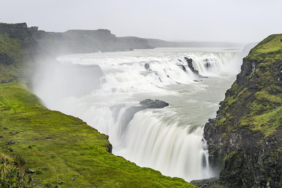 Gullfoss waterfall in Iceland seen from above on a cloudy stormy day Photograph by Sjo