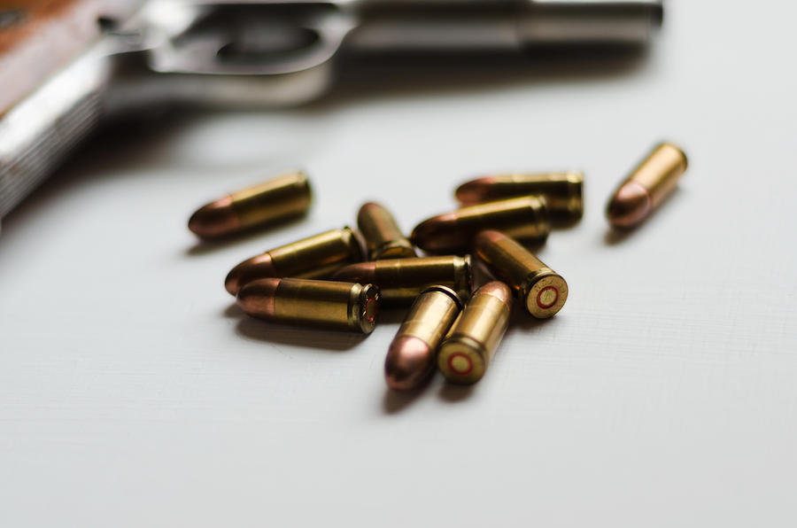 Gun and bullets Photograph by Elizabeth Fernandez