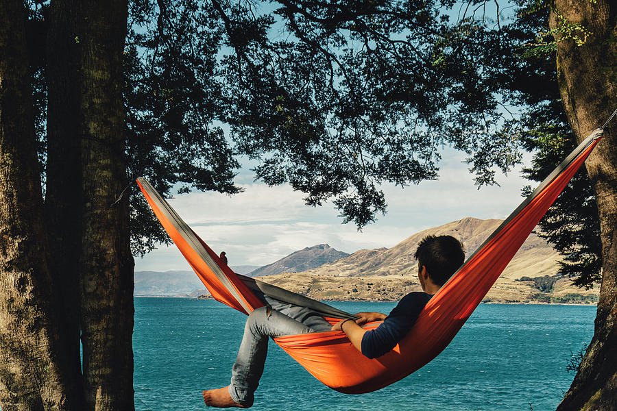 [Image: guy-in-hammock-looking-at-the-lake-mathieu-b-morin.jpg]