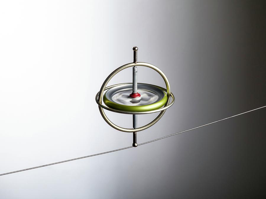 Gyroscope Balancing On A Wire Photograph by Science Photo Library