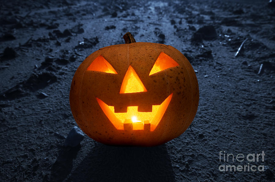 Halloween glowing pumpkin at night Photograph by Michal Bednarek