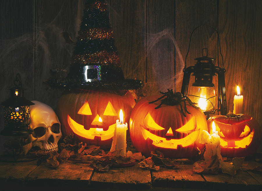 Halloween Jack-o-Lantern Pumpkins on rustic wooden background Photograph by Eli_asenova