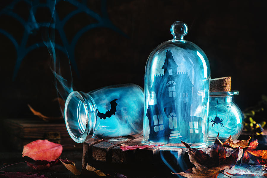 Halloween jars with smoke and haunred mansion Photograph by Dina Belenko Photography