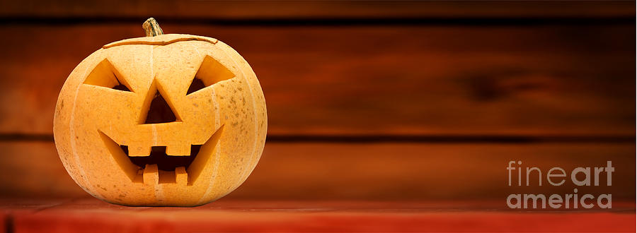 Halloween pumpkin. Wooden background Photograph by Michal Bednarek