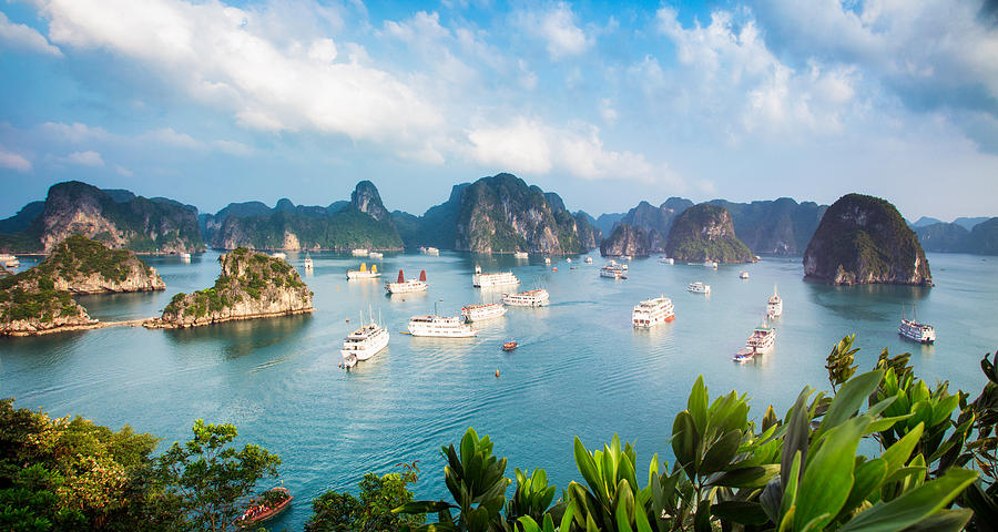 Halong Bay Vietnam panorama at sunset with anchored ships Photograph by NicolasMcComber