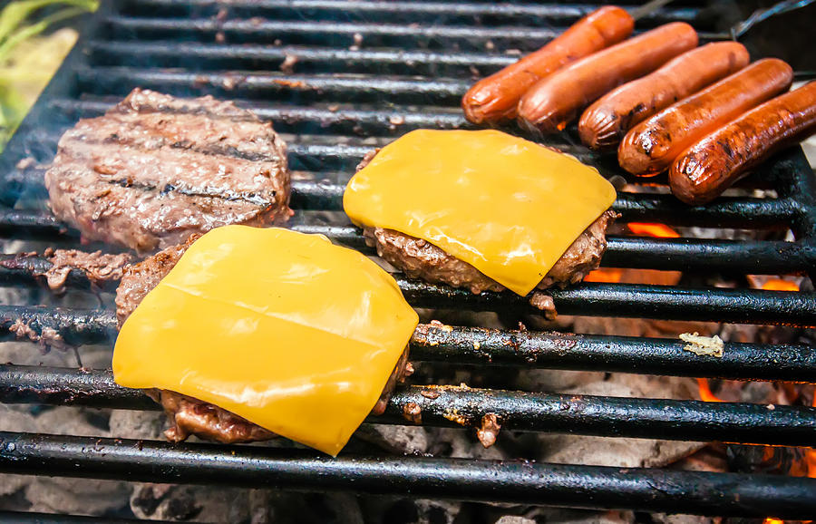 Hamburgers With Cheese And Hot Dogs On Grille Photograph by Alex Grichenko