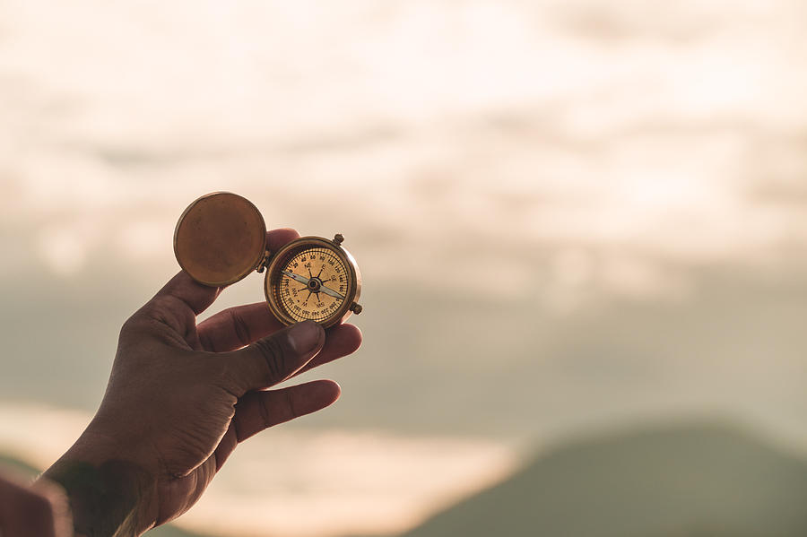 Hand Golding Compass To Navigate Direction,travel Direction Discovery Photograph by Pojcheewin Yaprasert Photography