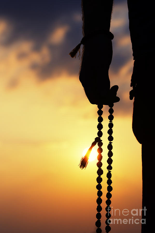 Sunset Photograph - Hand holding Rudraksha beads by Tim Gainey