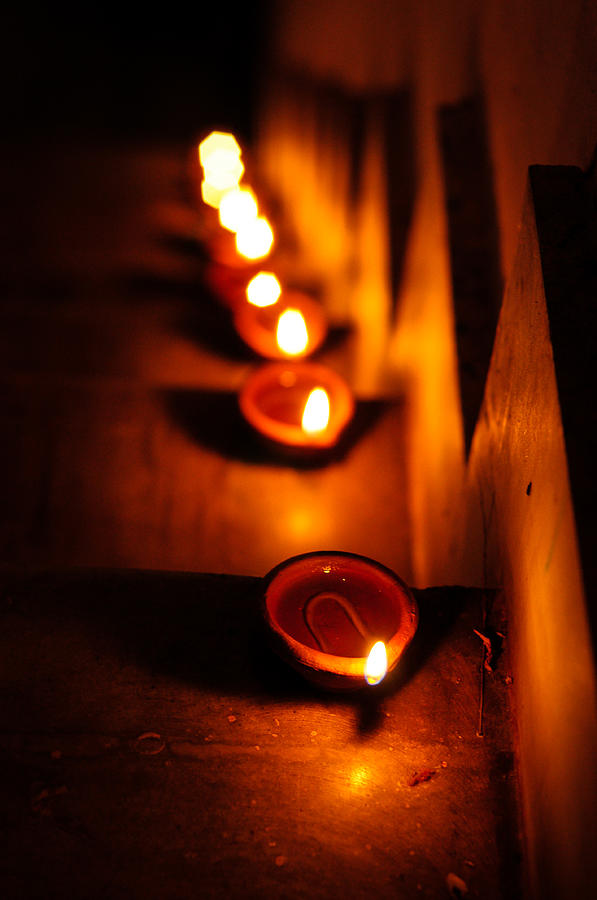 Hand made oil lamps decorated in the festive night of Hindu festival Diwali or Deepavali Photograph by Copyrights @ Arijit Mondal
