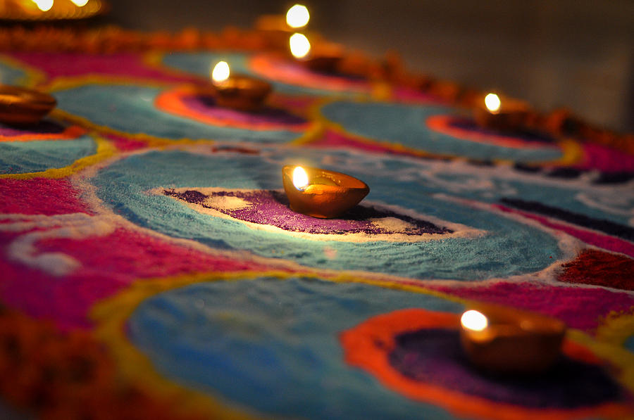 Hand made oil lamps decorated with Rangoli in the festive night of Hindu festival Diwali or Deepavali Photograph by Copyrights @ Arijit Mondal