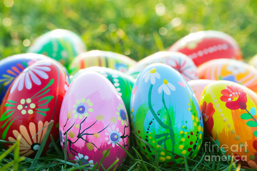 Easter Photograph - Hand painted Easter eggs on grass by Michal Bednarek
